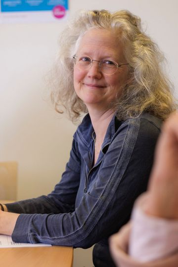 Werkoverleg met de begeleiders en verpleegkundigen onder begeleiding van een psychiater.